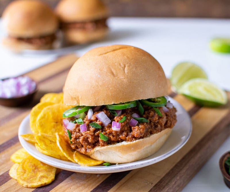 Finished Sweet Jerk Sloppy Joe with chips on a plate